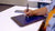 View of woman writing with Blackboard Smart Pen on Blackboard Letter